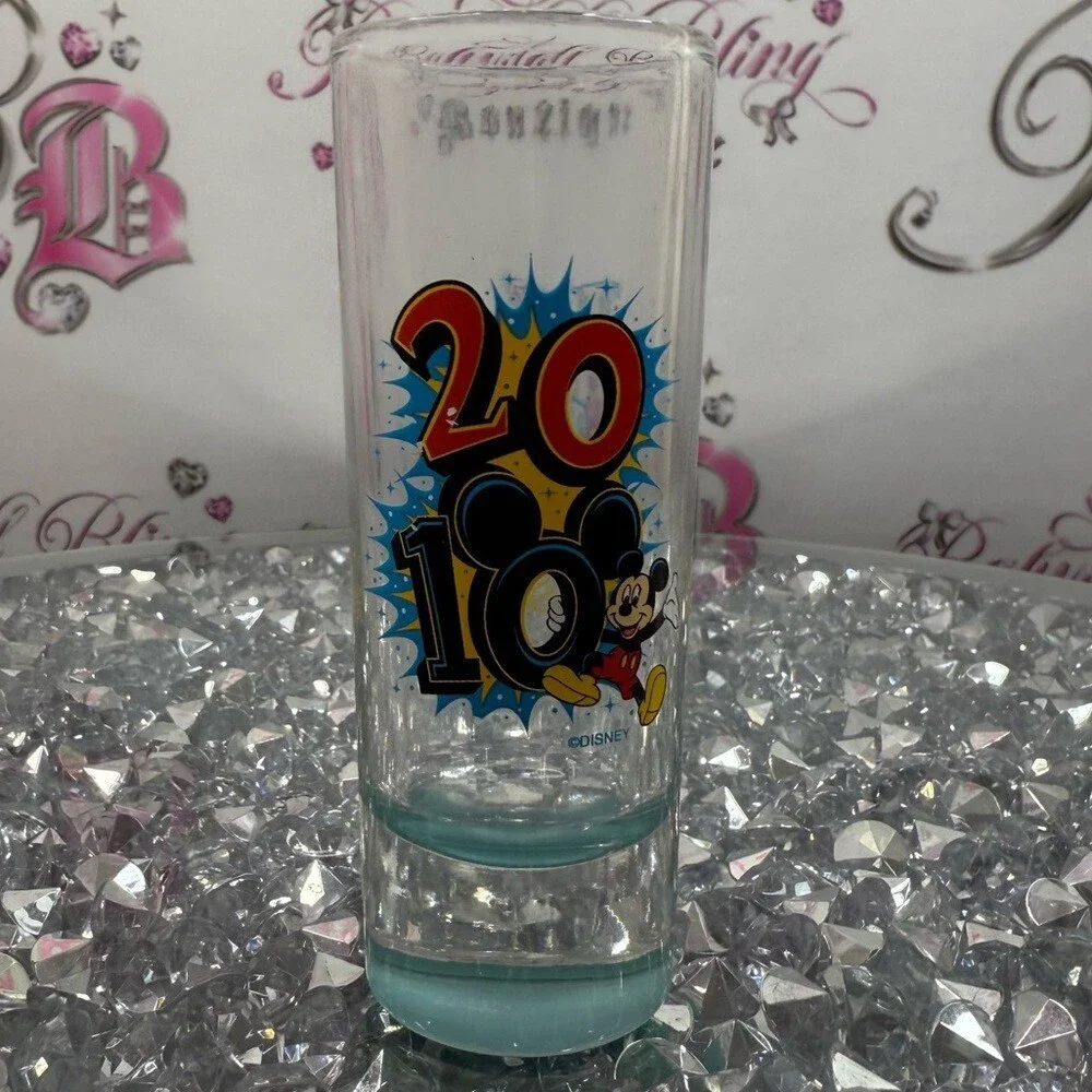 Disney Clear Shot Glass with Red, Yellow and Blue 2010 Mickey Graphic